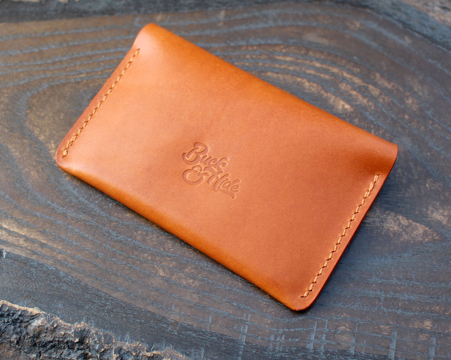 Tan/orange leather tuck-in card holder.