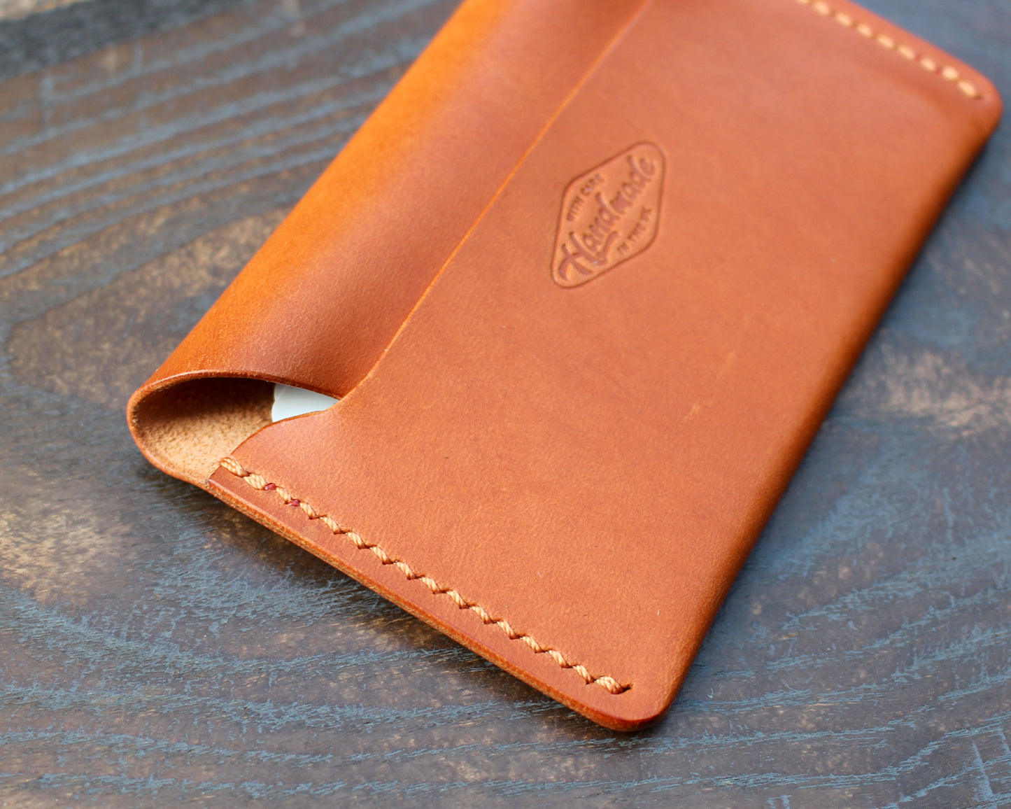 Tan/orange leather tuck-in card holder.