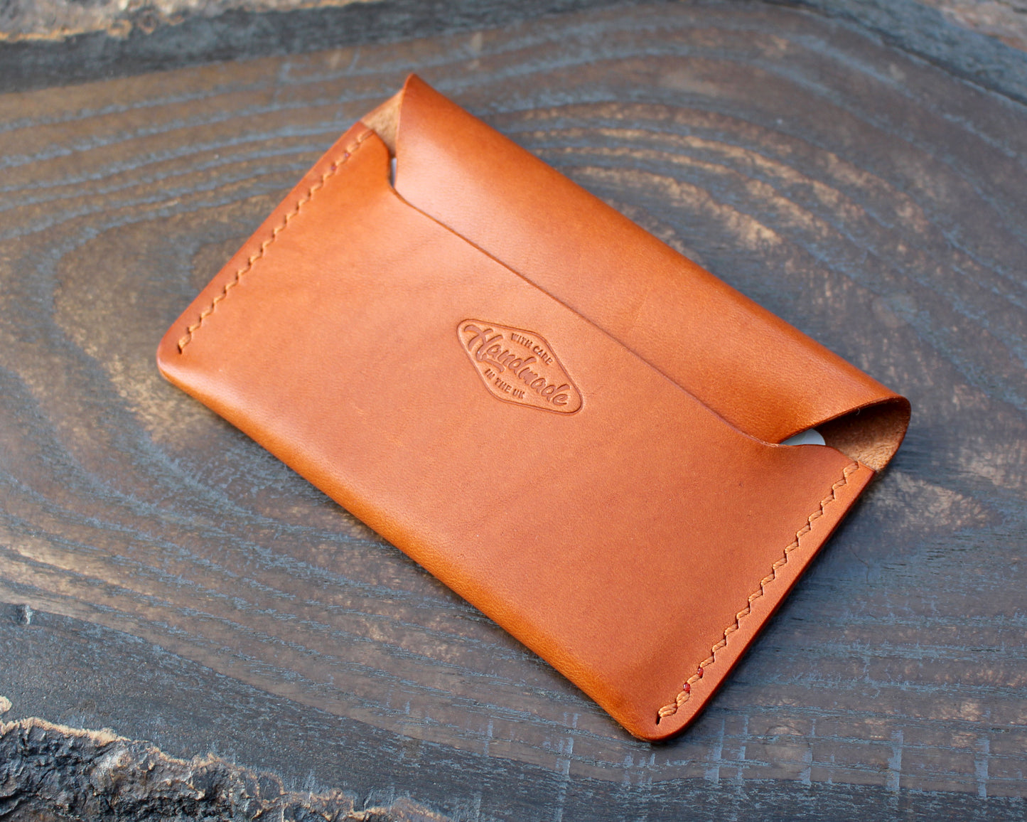 Tan/orange leather tuck-in card holder.