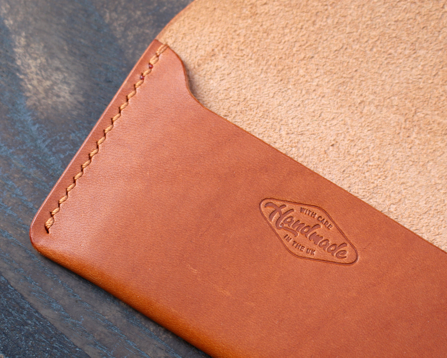 Tan/orange leather tuck-in card holder.