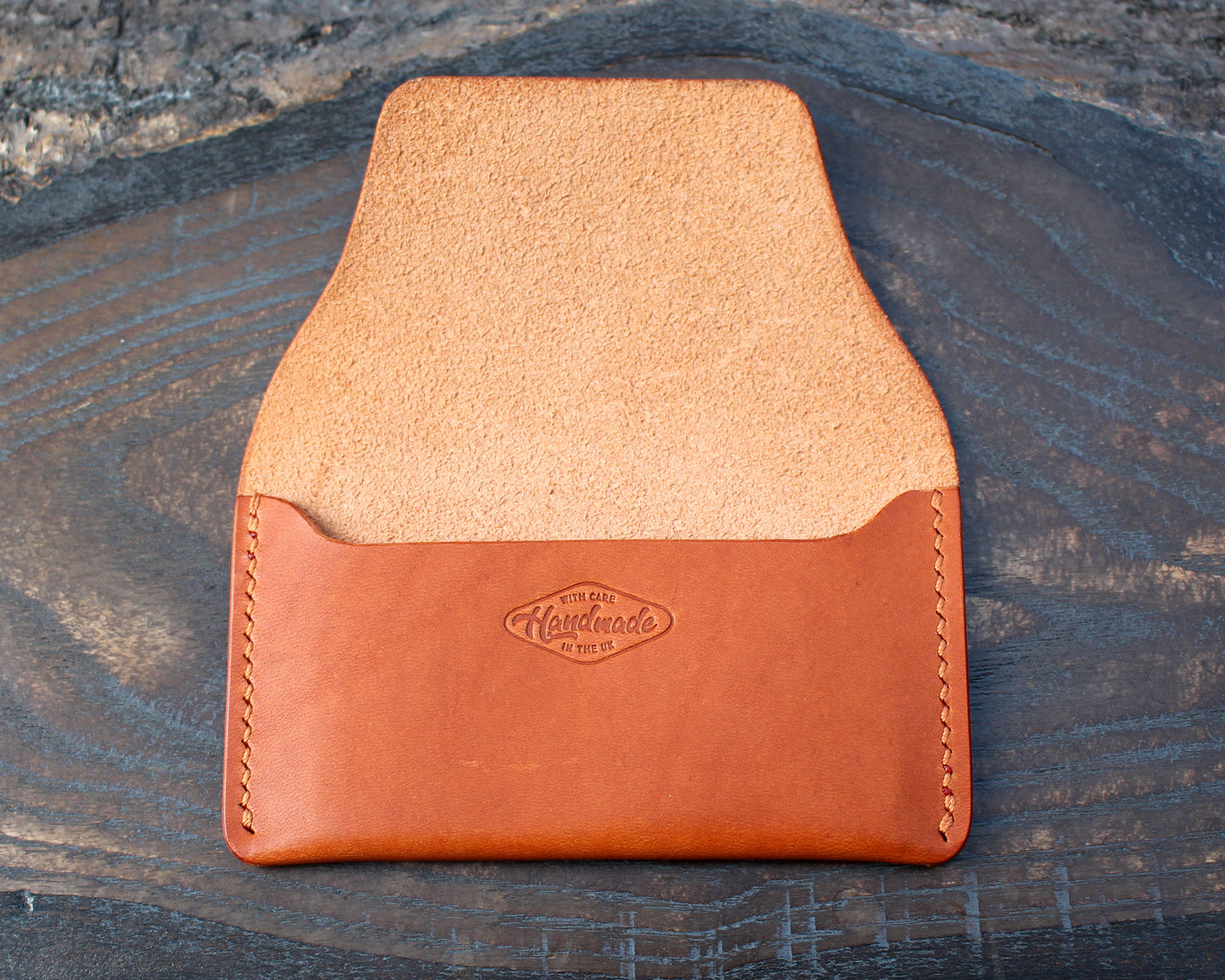 Tan/orange leather tuck-in card holder.