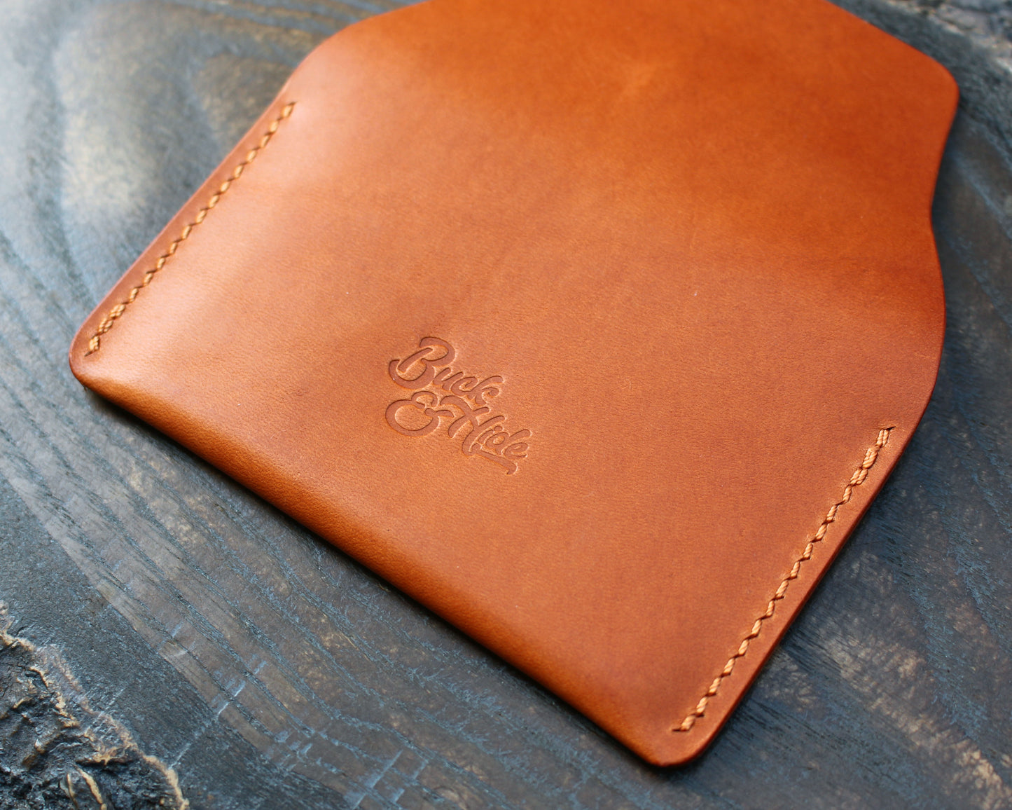 Tan/orange leather tuck-in card holder.