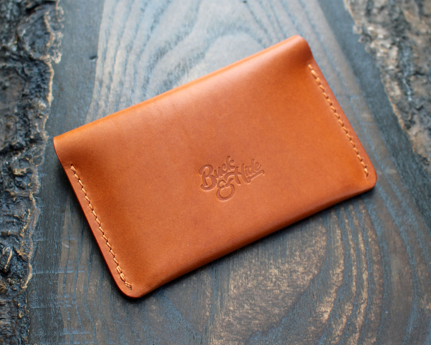 Tan/orange leather tuck-in card holder.