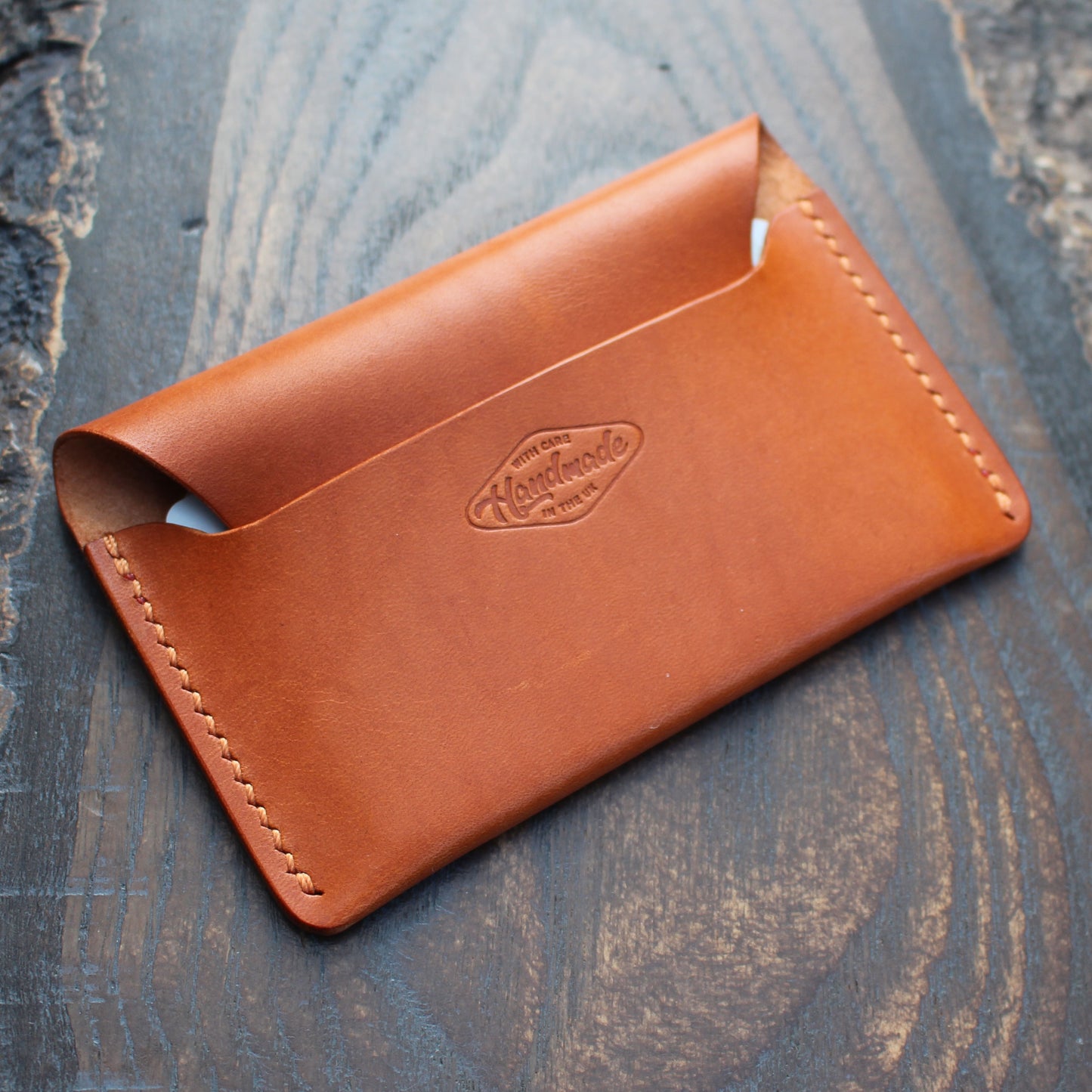 Tan/orange leather tuck-in card holder.