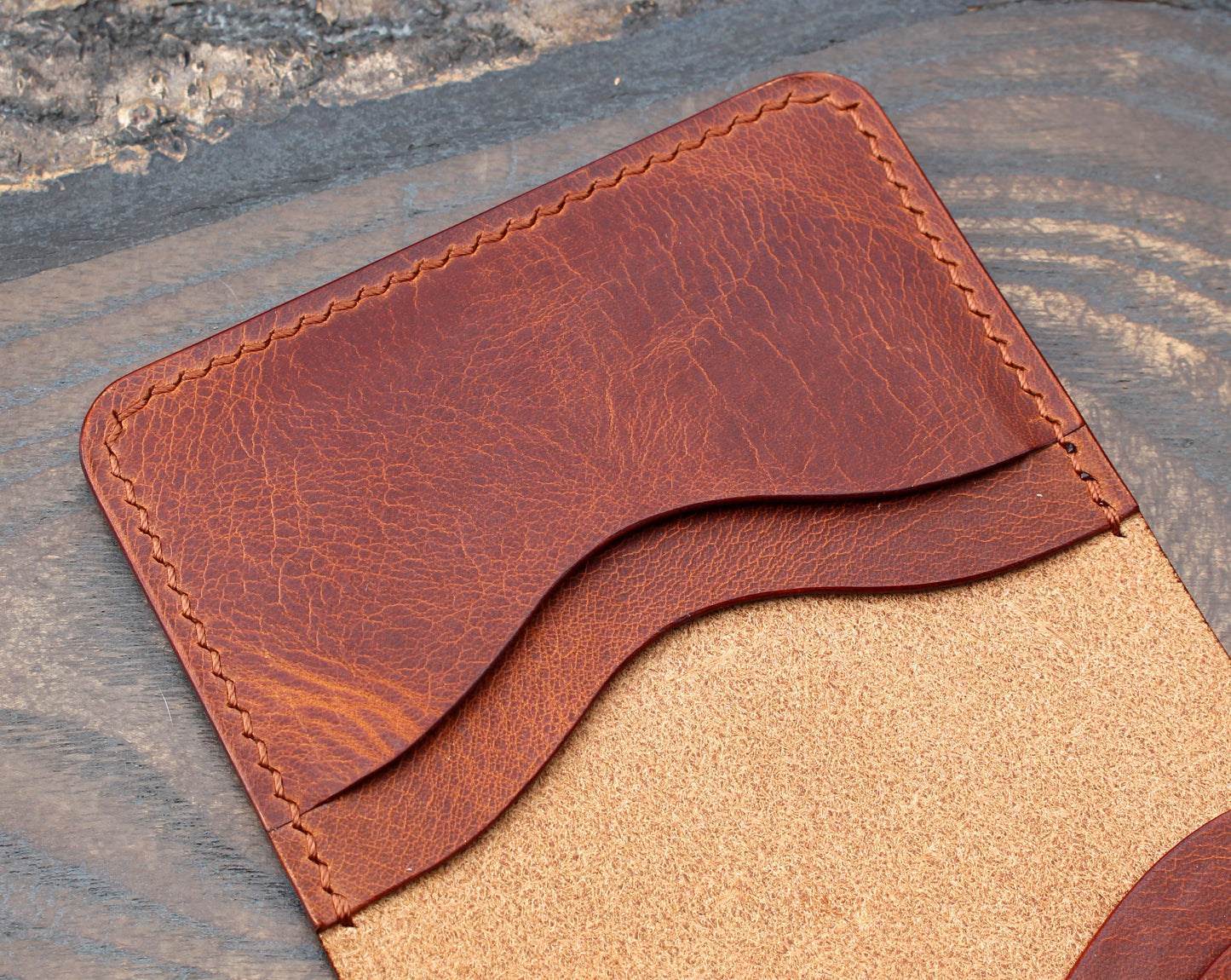 Five-slot bifold wallet, cognac Badalassi Wax leather.